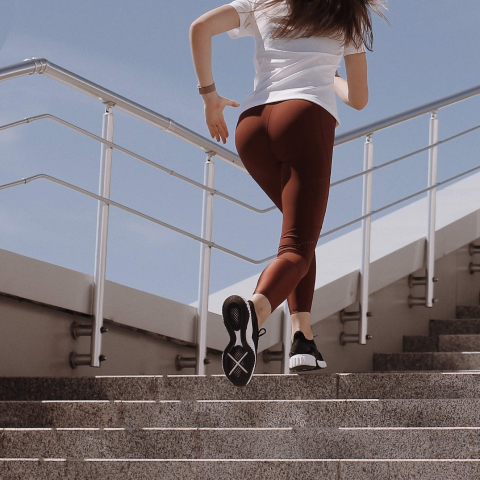 Girl running up the stairs